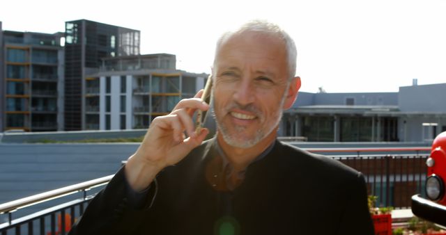 Confident Businessman Making Phone Call on Rooftop - Download Free Stock Images Pikwizard.com