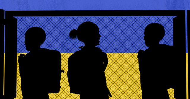 Silhouette of group of school kids against iron fence and ukraine flag background. ukraine crisis concept