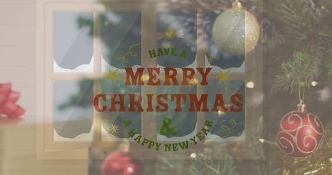 Festive Christmas Greeting on Frosted Window with Baubles