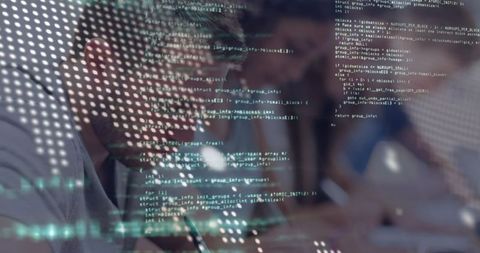 Developer taking notes with code overlay and digital interface