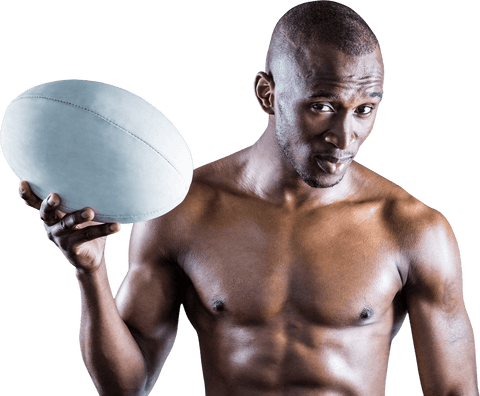Confident shirtless athlete posing with rugby ball on transparent background