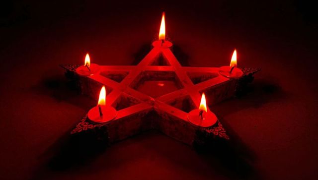Mystical pentagram candle holder with red glow in dark
