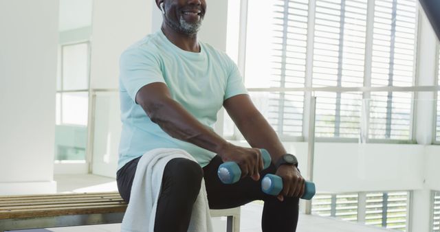 Image of happy senior american african men exercising. Retirement lifestyle, spending time alone,active leisure time.