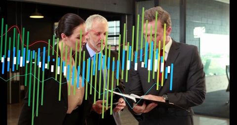 Executives reviewing financial reports with colorful analytics overlay in office lobby