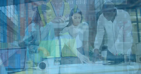 Diverse Team Analyzing Business Data in Office