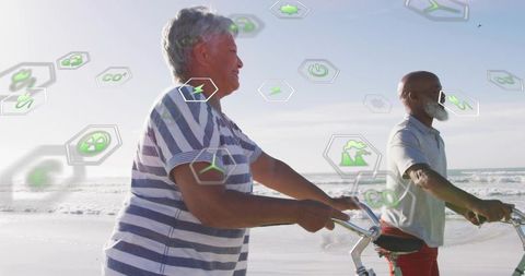 Senior couple cycling on beach with floating green energy icons