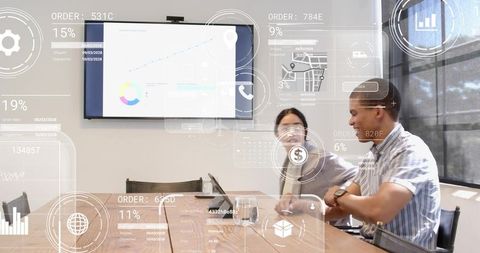 Business team reviewing analytics dashboard in bright meeting room with data overlays