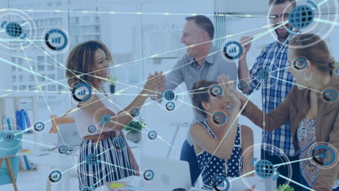 Diverse Business Team Celebrating Success in High-Tech Office