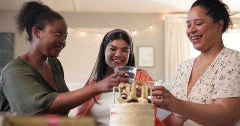 Diverse Friends Celebrating 30th Birthday with Cake and Cheers