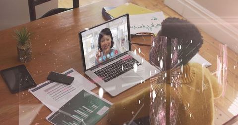 Businesswoman Video Conferencing From Home Office