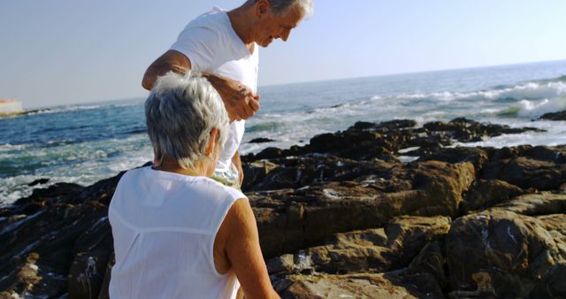 Senior Couple Exploring Rocky Coastline Near Ocean - Download Free Stock Images Pikwizard.com