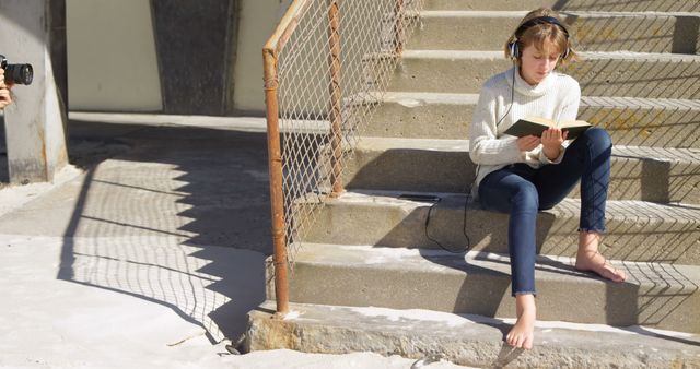 Girl Enjoying Music and Poetry on Sunny Outdoor Steps - Download Free Stock Images Pikwizard.com