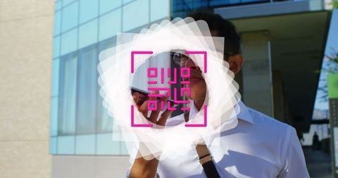 Businessman with qr code overlay using smartphone outdoors