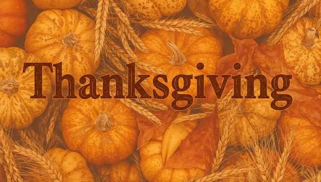 Warm thanksgiving harvest composition with mini pumpkins, wheat stalks, autumn leaves