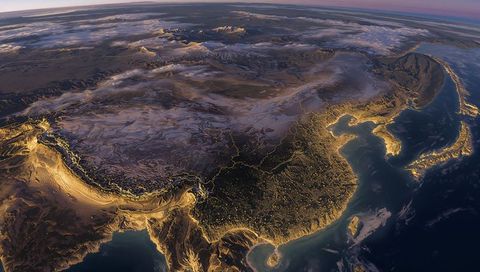 Orbit View of East Asia with Glowing Coastlines and Himalayan Peaks