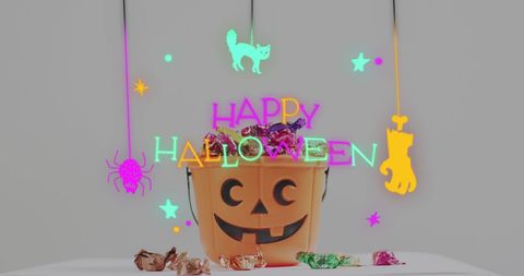 Halloween Pumpkin Bucket with Candies and Neon Decorations - Download Free Stock Images Pikwizard.com