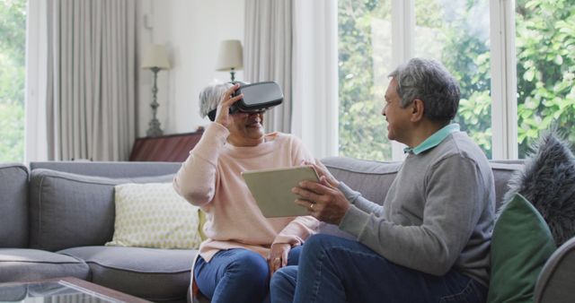 Senior couple exploring virtual reality at home - Download Free Stock Images Pikwizard.com