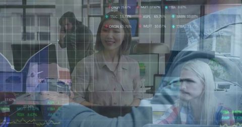 Smiling businesswoman collaborating over laptops with data overlays and financial charts
