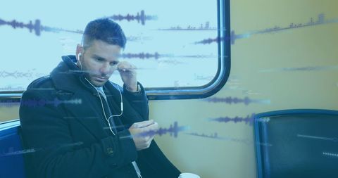 Businessman Listening to Music on Train with Audio Visuals