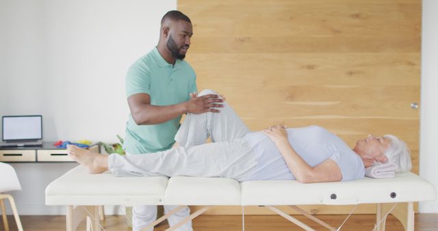 Physiotherapist Conducting Therapy with Elderly Patient on Table - Download Free Stock Images Pikwizard.com