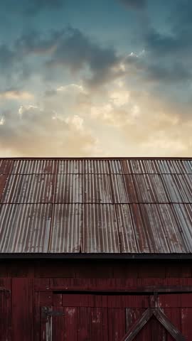 Shifting Camera Revealing Weathered Red Barn Roof and Expansive Sky Vertical Farm