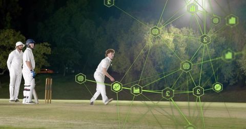 Night cricket bowler running to batsman with neon data overlay for live sports analytics