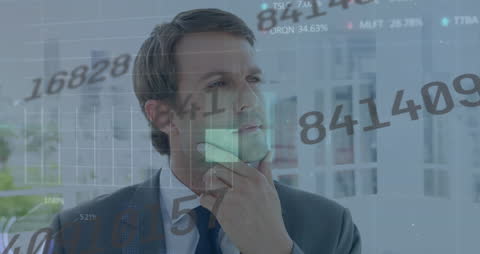 Businessman Analyzing Data and Numbers in Office Environment