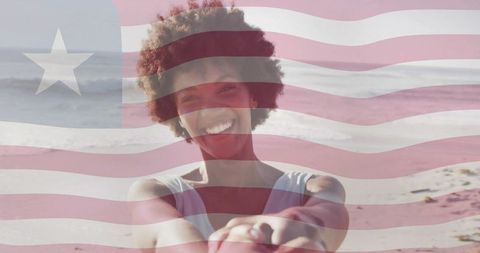 Happy Woman on Beach with Liberian Flag Overlay