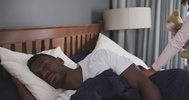 Father Sleeping Peacefully In Cozy Bedroom While Child Approaches - Download Free Stock Images Pikwizard.com