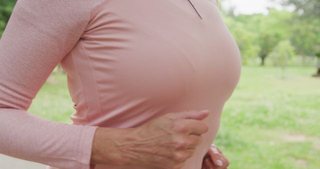 Close-up Detail of Woman Jogging in Park with Pink Athletic Wear - Download Free Stock Images Pikwizard.com