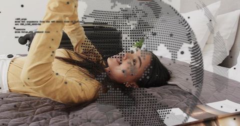Reclining woman holding smartphone with augmented globe overlay for mobile connectivity