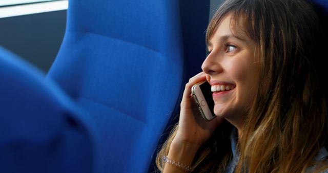 Young Woman Smiling While Talking on Smartphone - Download Free Stock Images Pikwizard.com