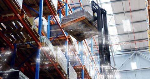 Forklift Lifting Pallet in High-Tech Warehouse