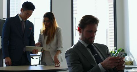 Businessman Engaged with Smartphone in Modern Office - Download Free Stock Images Pikwizard.com