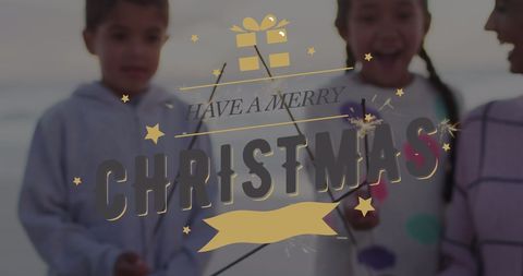 Merry Christmas Celebration with Family on Beach Holding Sparklers