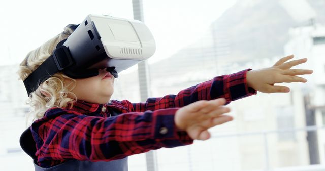 Child Exploring Virtual Reality Technology Indoors - Download Free Stock Images Pikwizard.com