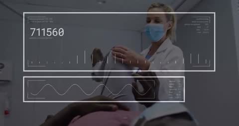 Medic flexing patient knee with digital interface and data visuals
