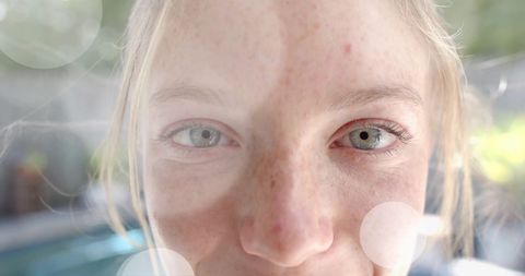 Close-Up of Smiling Caucasian Teenage Girl in Garden