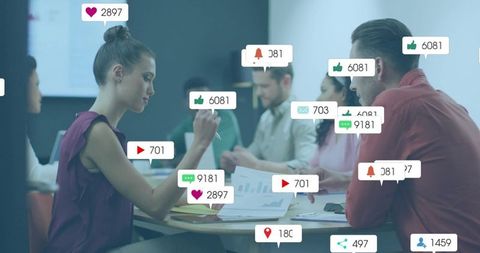 Team collaborating and reviewing analytics with social engagement icons