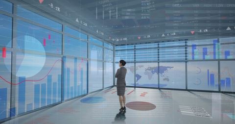 Businesswoman analyzing global financial data on virtual display