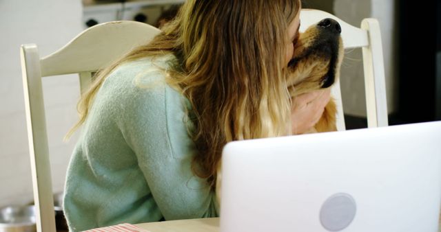 Woman Kissing Labrador Retriever at Home Office Desk - Download Free Stock Images Pikwizard.com