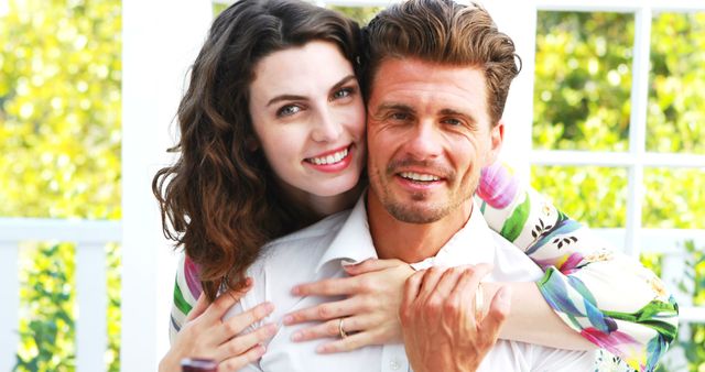 Portrait of romantic couple embracing each other in restaurant