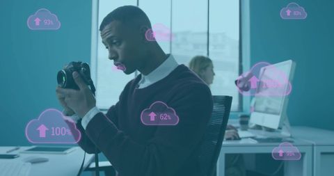 Businessman Enhancing Photography with Cloud Technology in Office