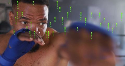 Shirtless boxer training, throwing blurred punch with blue hand wraps and green binary overlay