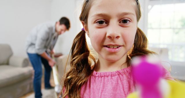 Smiling Young Girl with Father Cleaning Living Room Background - Download Free Stock Images Pikwizard.com