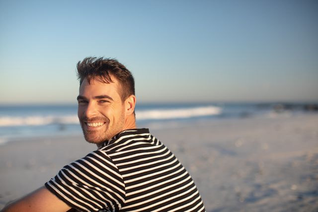 Portrait of happy man relaxing on the beach