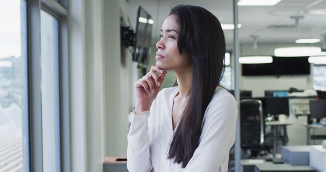 Pensive Businesswoman Looking Out of Office Window Contemplating - Download Free Stock Images Pikwizard.com