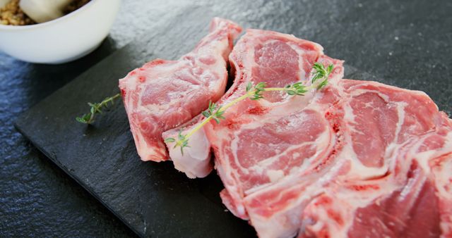 Raw Pork Chops with Thyme on Slate Board for Culinary Creations - Download Free Stock Images Pikwizard.com