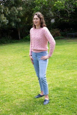 Woman Enjoying Nature in Pink Sweater and Jeans