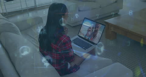 Woman Video Calling on Laptop with Digital Data Overlay